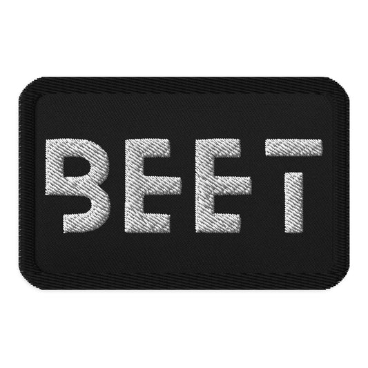 Black patch featuring the BEET logo.