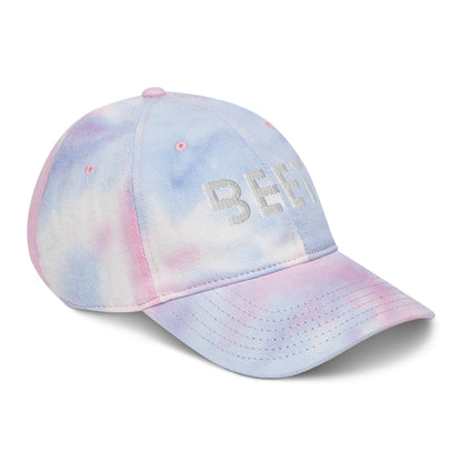 BEET tie dye baseball cap featuring vibrant, multi-colored patterns with the BEET logo on the front.